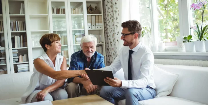 Home sellers meeting with a Realtor for the first time to discuss selling their house