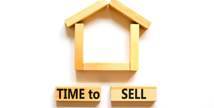 House shape above blocks that say time to sell