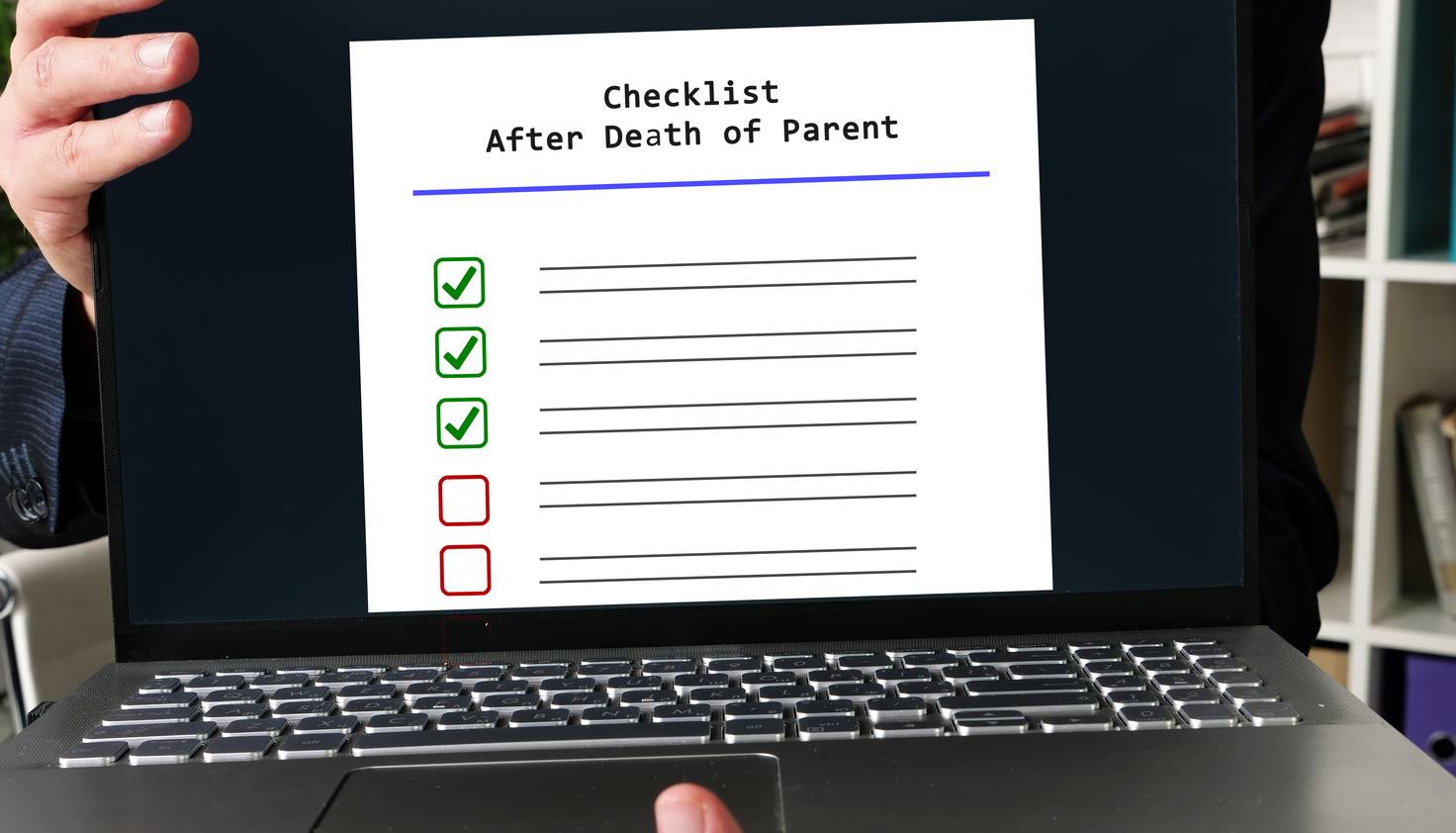 Person holding a laptop displaying a checklist for selling a home after the death of a parent.