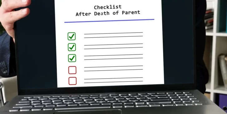 Laptop displaying a checklist after the death of a parent