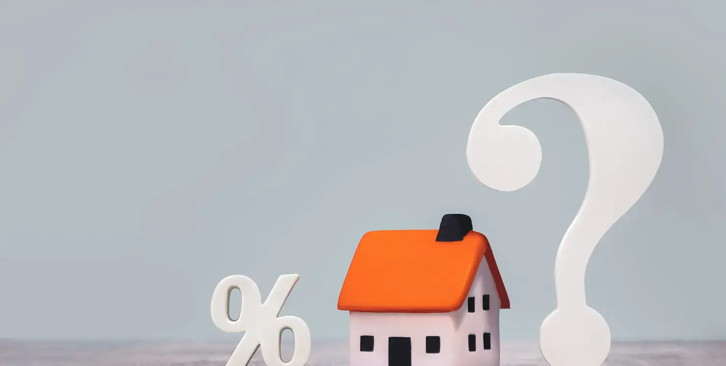 House model with a percent sign and question mark, representing real estate agent commission